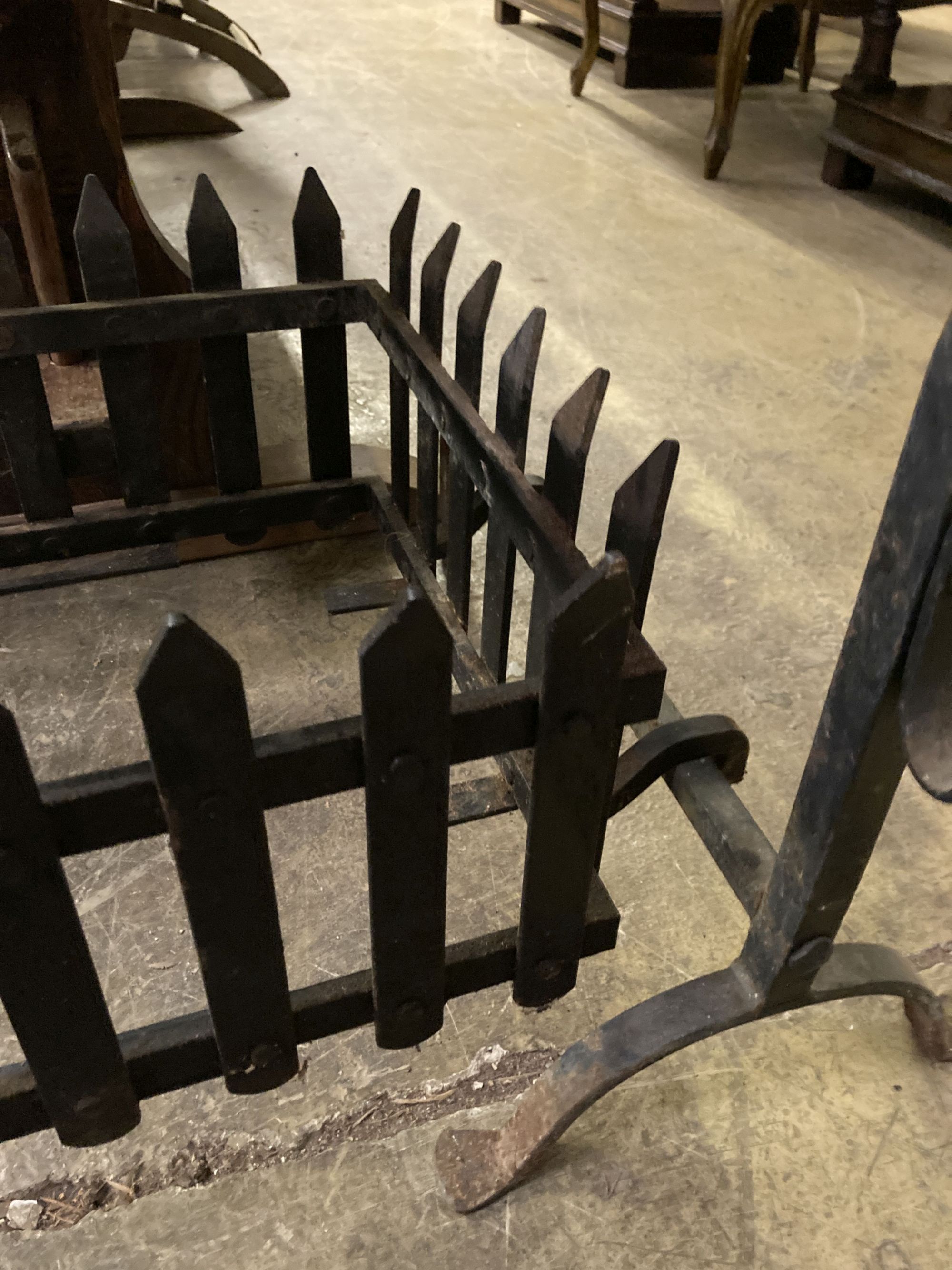 A rectangular wrought iron fire basket, width 114cm, depth 56cm, height 62cm and dogs